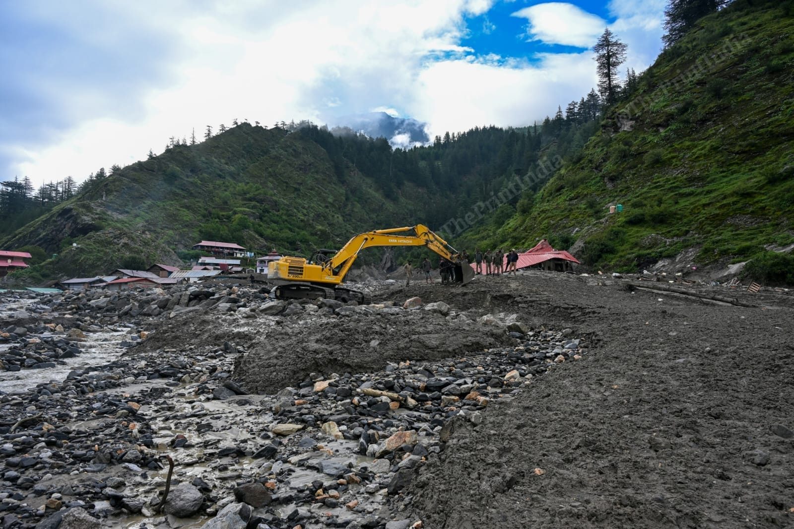 BRO workers trying to clear up the road with a JCB | Suraj Singh Bisht | ThePrint