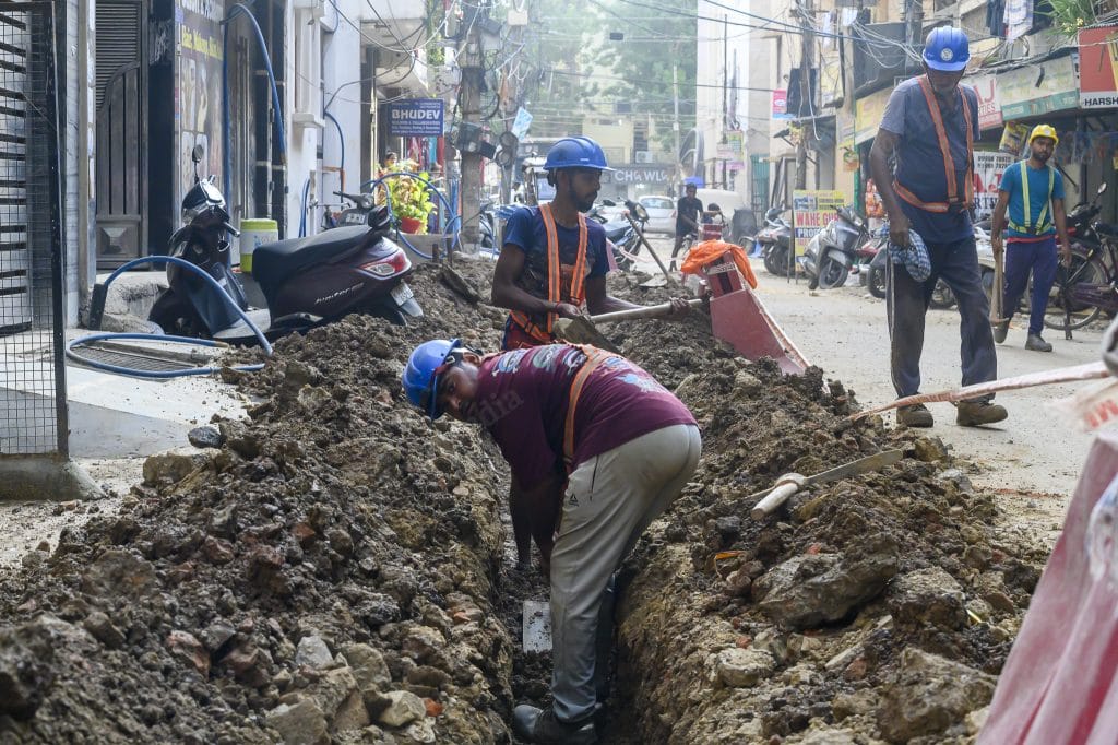 Workers drilling the ground to underground wires at BH Block, Shalimar Bagh. It is the Chief Minister's constituency | Ankit Roy Majumder