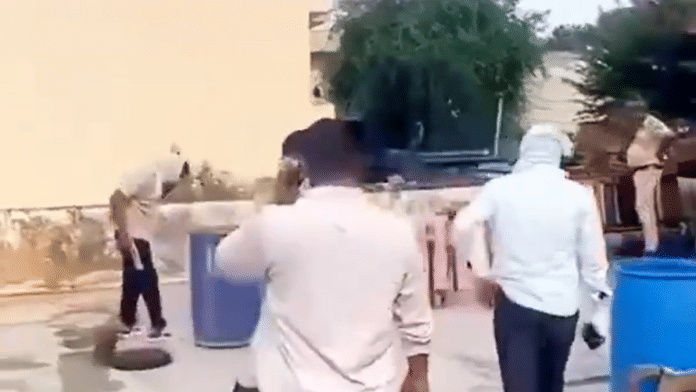 Screengrab from video showing ppolice investigation on the murder on a man in Rajasthan | X