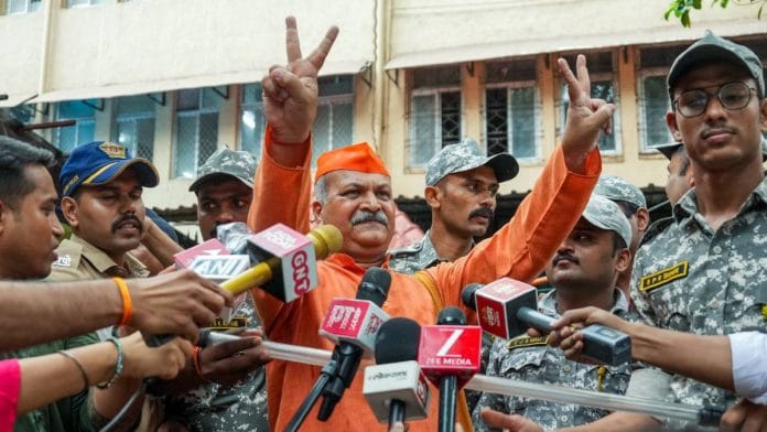 Sameer Kulkarni, one of seven accused in the 2008 Malegaon blast case, shows a victory sign while leaving a sessions court in Mumbai Thursday | Photo: PTI
