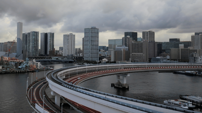 A view of the Tokyo skyline is seen through the window of a bus in Tokyo, Japan | Representational image | Reuters