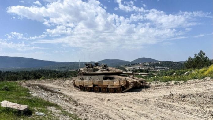 An Israeli tank is positioned on the Israeli side of the Israel-Lebanon border, March 18, 2025 | REUTERS
