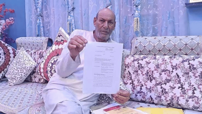Mandi-resident Mir Bakhsh shows court order restoring his ancestral land to him | By special arrangement