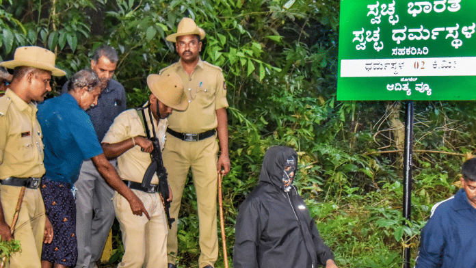 File photo of the whistleblower (covered in all black) in the Dharmasthala case | PTI File Photo