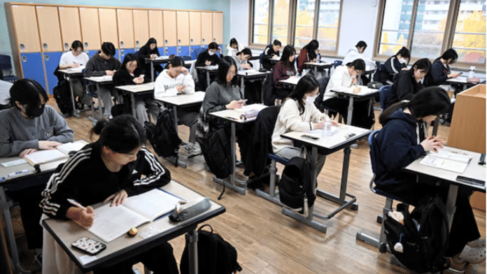 South Korean students wait to take the annual College Scholastic Ability Test at a school in Seoul, South Korea, November 14, 2024 | Reuters
