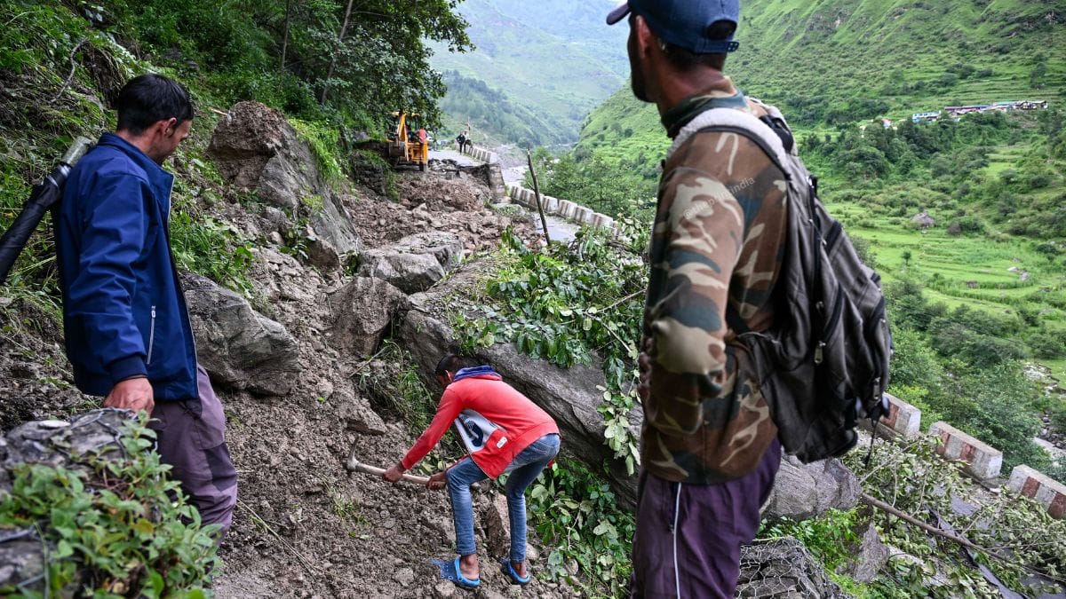 Local worker using a plough to clear landslide debris in Uttarkashi | Suraj Singh Bisht | ThePrint