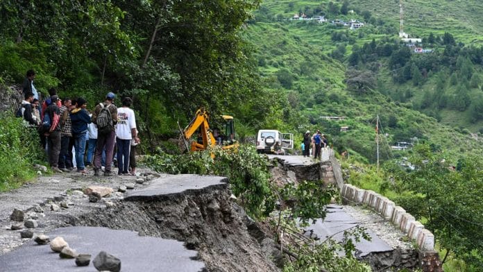 Onlookers watch as JCB clears debris to make way for rescuers | Suraj Singh Bisht | ThePrint