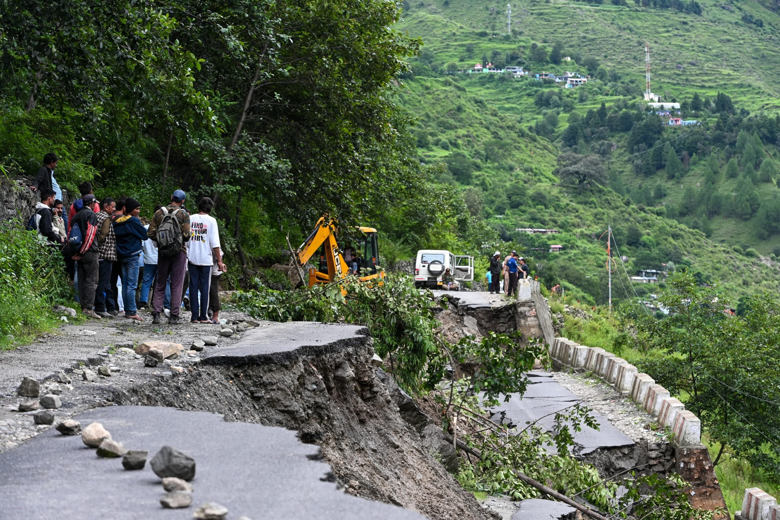 Local residents trying to cross the road as the situation turns dangerous | Photo: Suraj Singh Bisht | ThePrint