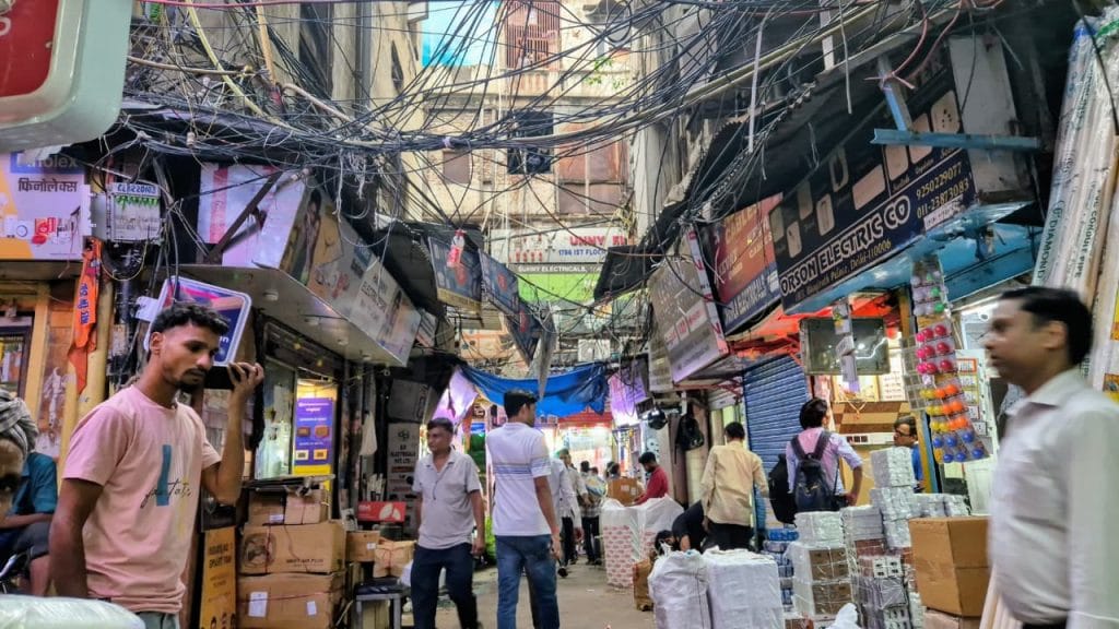 Despite a major fire in 2022 in which more than 100 shops were gutted, overhead wires still rules the skies at Bhagirath Palace| Shubhangi Misra | ThePrint