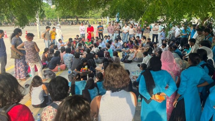 Housekeeping workers at the gate of the Ashoka University