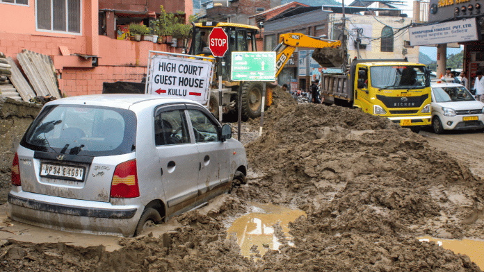 Earthmover being used to remove a vehicle stuck in mud and debris washed along flash floods triggered by cloudburst, in Kullu, Himachal Pradesh, Wednesday, Aug. 20, 2025 | Representational image | PTI
