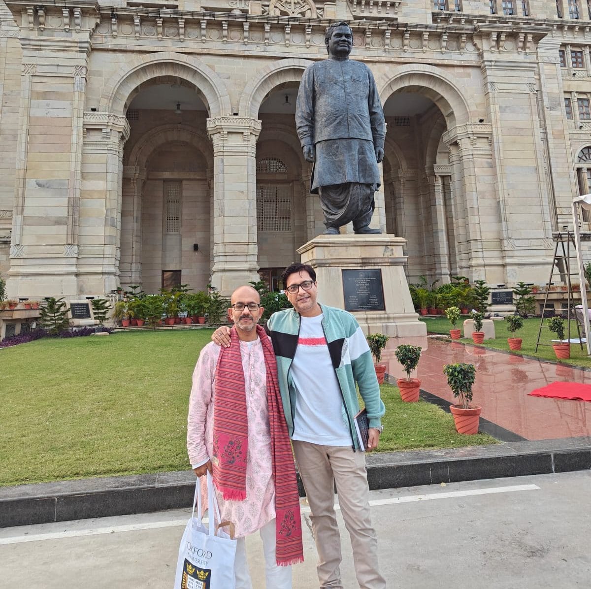 Shantanu Gupta and Dilip Jha pose in front of Lok Bhawan at Lucknow