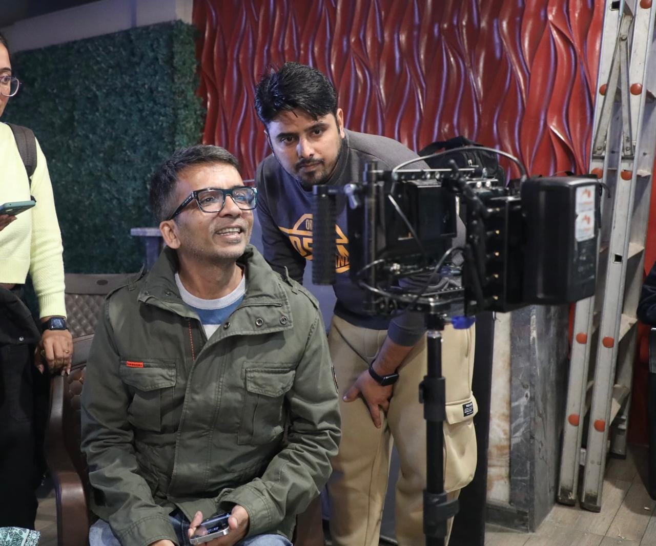 Ravindra Gautam directing a scene from the film