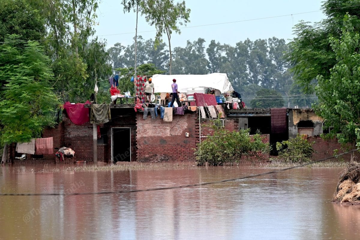 Most of the people living on their roof after the village got submerged due to flood | Suraj Singh Bisht | ThePrint