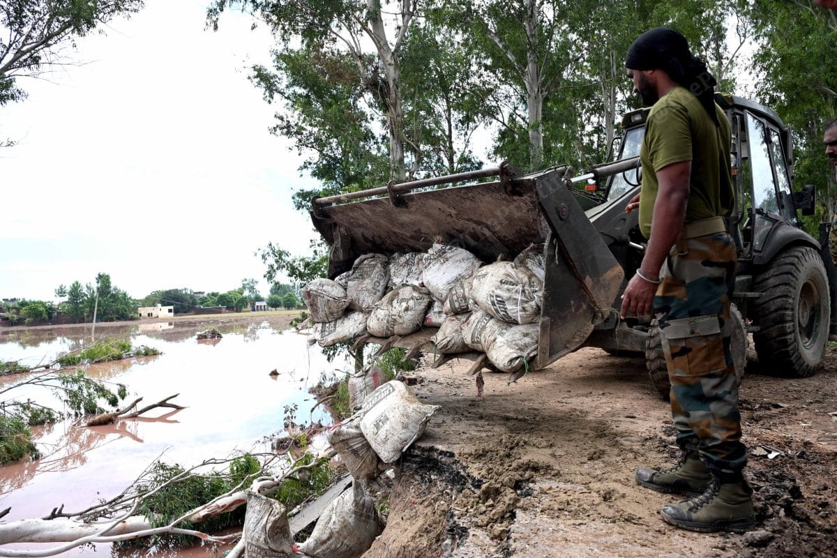 Army personnel arrived to help build temporary roads after roads disappeared due to flood | Suraj Singh Bisht | ThePrint