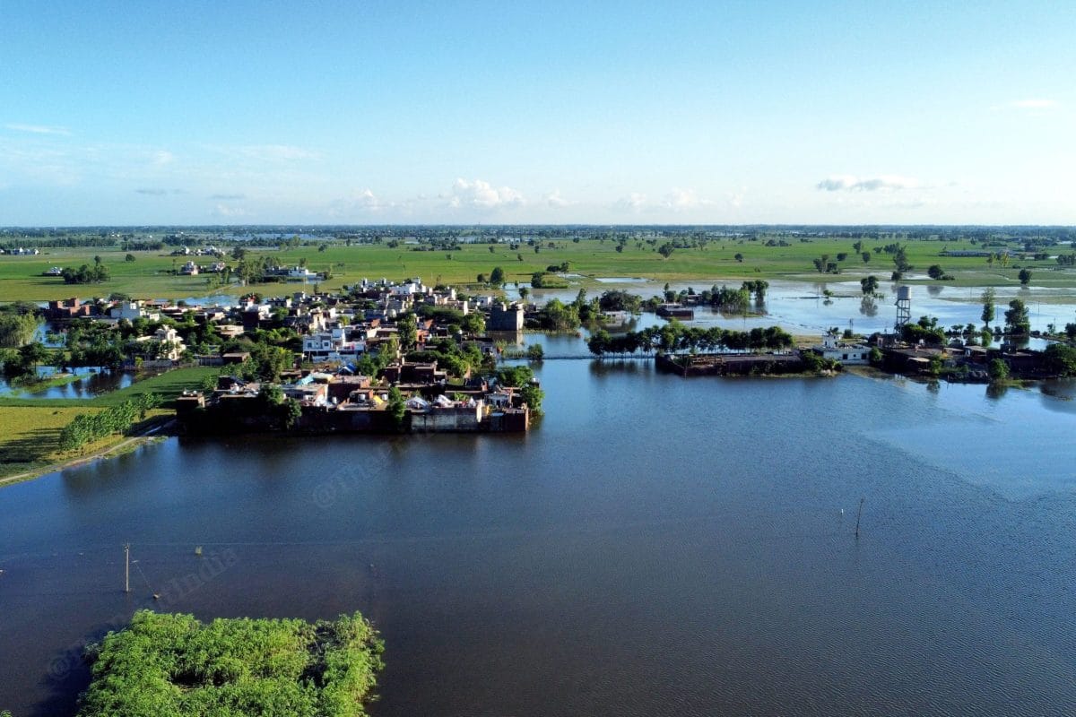 Ariel view of submerged fields and houses | Suraj Singh Bisht | ThePrint