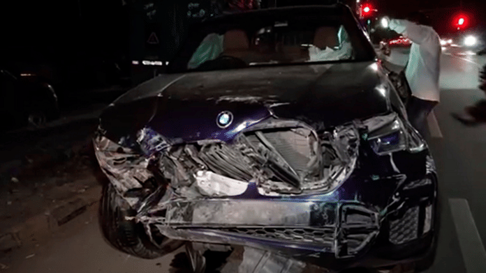 Wreckage of the BMW car lies on the side of the road after an accident in a which a senior official of the Ministry of Finance was killed on 14 September 2025. | PTI