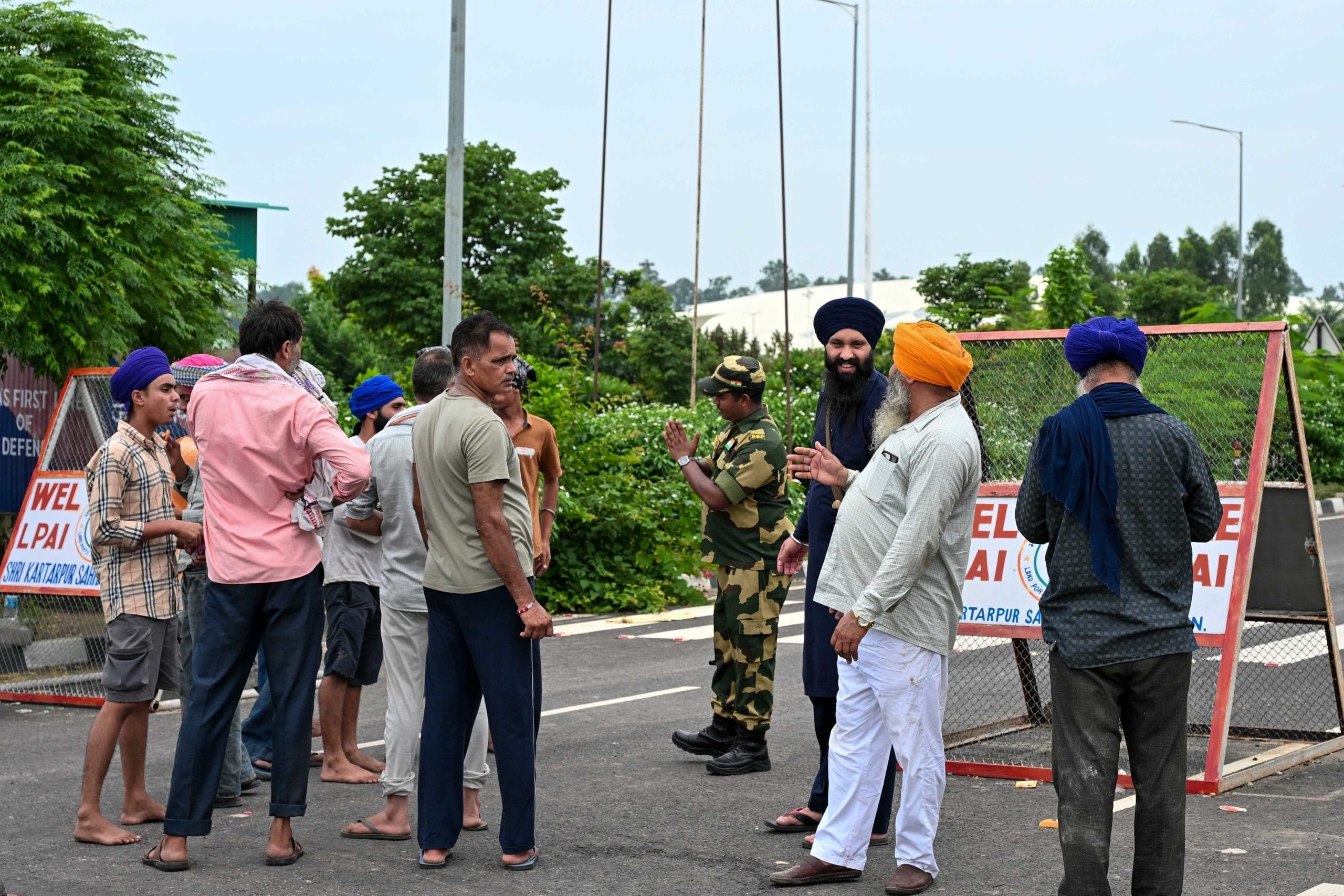 BSF personnel talk to locals at a barricade | Suraj Singh Bisht | ThePrint