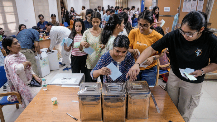 A student casts her vote in the Delhi University Students' Union (DUSU) elections, in North Campus, New Delhi, 18 September 2025. | PTI