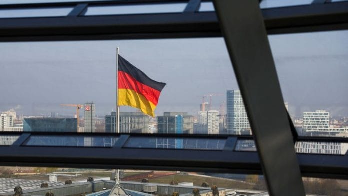 German national flag flutters on top of the Reichstag building, that seats the Germany's lower house of parliament, the Bundestag, in Berlin on 25 March 2025. | File Photo | Lisi Niesner | Reuters