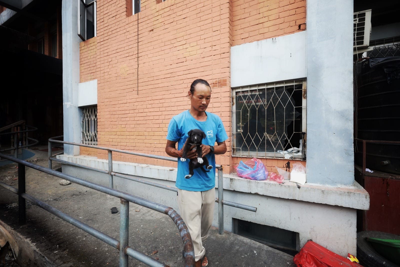 An animal feeder with a puppy that was found lost in the aftermath in the violence in Kathmandu | Manisha Mondal | ThePrint