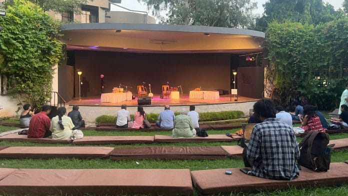 People sitting in the amphitheatre, gearing up for a performance | Antara Baruah, ThePrint