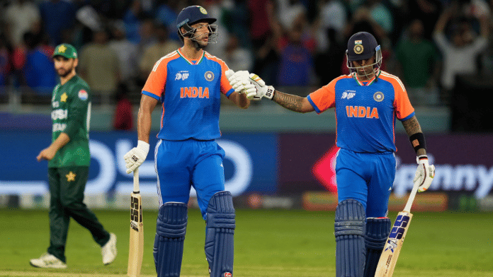 India's captain Suryakumar Yadav, (R), & batting partner Shivam Dube are seen walking off the pitch after winning in the Asia Cup match against Pakistan at Dubai International Cricket Stadium without shaking hands with the Pakistani team on 14 September 2025. | PTI