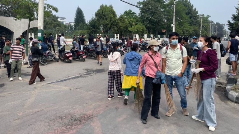 ‘This is who we are’—as dust settles, Kathmandu residents pick up brooms, hand out food & water