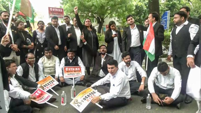 Lawyers protest outside Rouse Avenue Court last month against the Delhi LG’s notification allowing police personnel to give evidence to court from police stations via video conferencing | ANI video grab