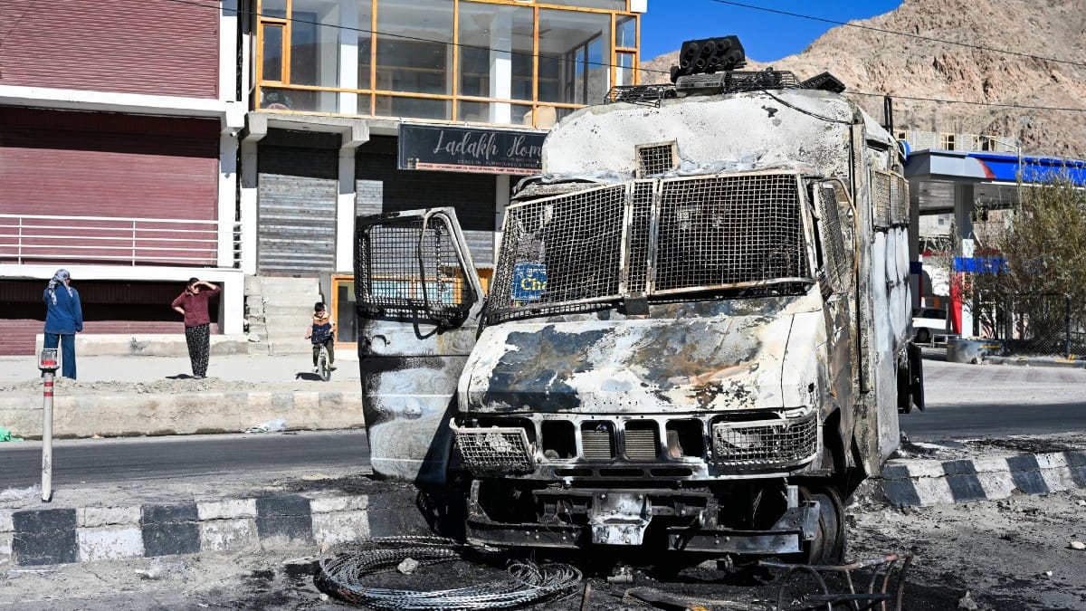 Charred remains of a vehicle set ablaze by a mob in Leh on Wednesday | ThePrint/Suraj Singh Bisht