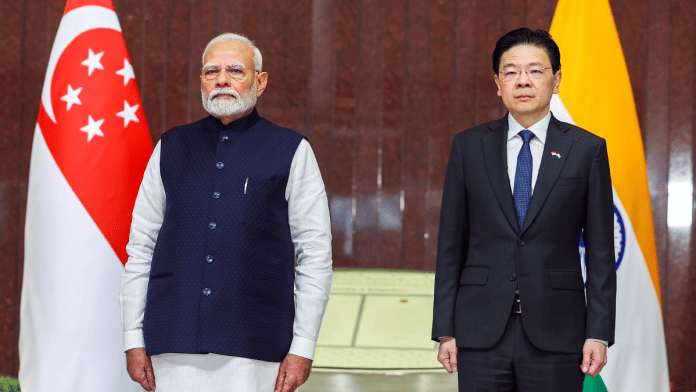 File photo of Prime Minister Narendra Modi with Singapore PM Lawrence Wong during the former's ceremonial welcome at Singapore's Parliament House, 04 September 2024 | ANI