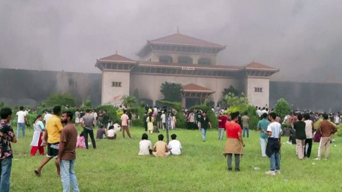 Protesters set the Parliament building on fire as the protest turned violent, in Kathmandu on Tuesday | ANI Video Grab