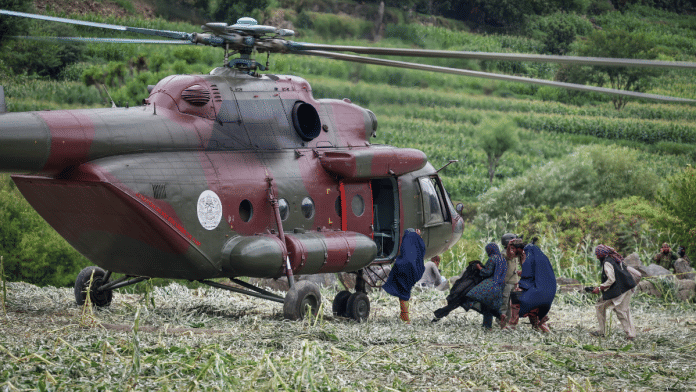 A Taliban military helicopter evacuates the victims of a deadly magnitude-6 earthquake that struck Afghanistan on Sunday, in Mazar Dara, Kunar province, Afghanistan, on 2 September 2025. | Sayed Hassib | Reuters