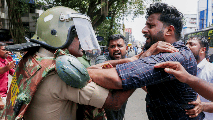 Youth Congress activists clash with police during a protest against the assault of one of their leaders, in Thiruvananthapuram on Monday | PTI
