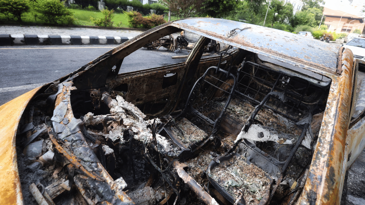 The charred remains of a car burnt by the protesters in the VIP lane of Kathmandu. | Manisha Mondal/ThePrint 