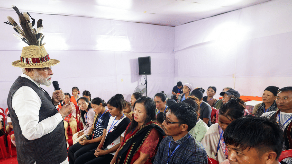 Prime Minister Narendra Modi interacts with violence-hit displaced people in Churachandpur. | (DPR PMO/ANI Photo)