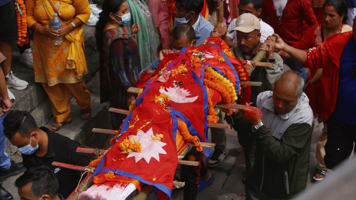 Last remains of Bhimraj Dhami,one of the deceased protesters, draped in national flag of Nepal being taken for cremation. | Manisha Mondal/ThePrint