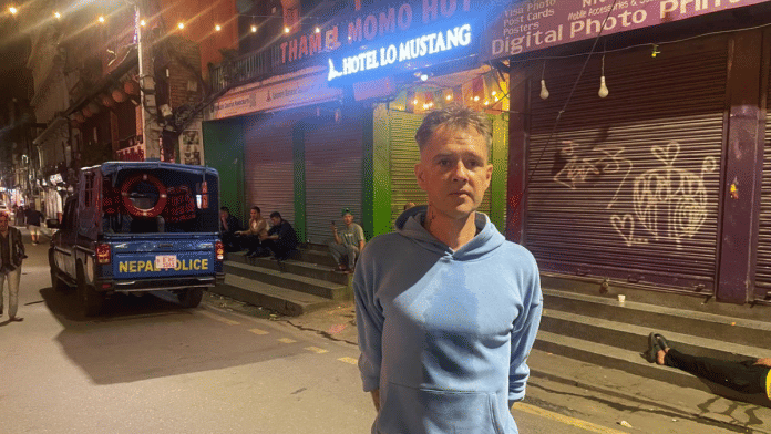 John, from Finland, says Nepal is one of the best countries in world. 'Many countries have corruption, but here they are burning things & I think it's good. It needed to happen.' | Udit Hinduja/ThePrint