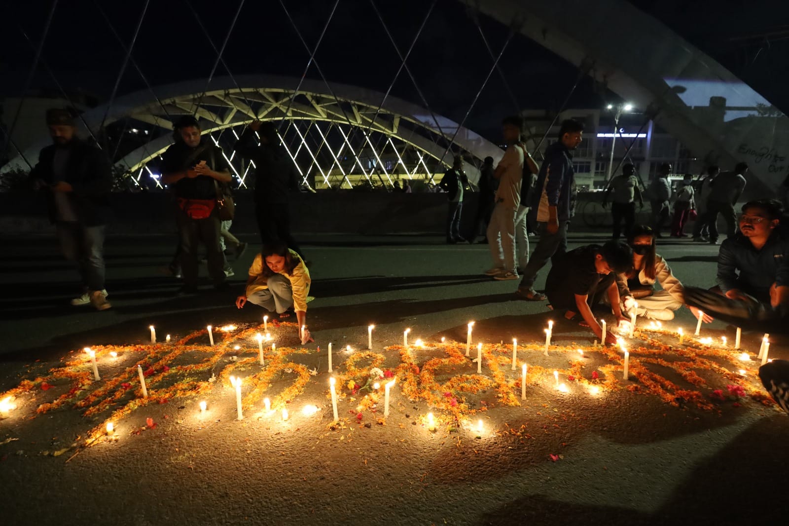 Flower petals are arranged to depict 'Hardik Shradhanjali' (heartfelt tribute) in memory of the people who lost lives in the recent uprising | Manisha Mondal | ThePrint