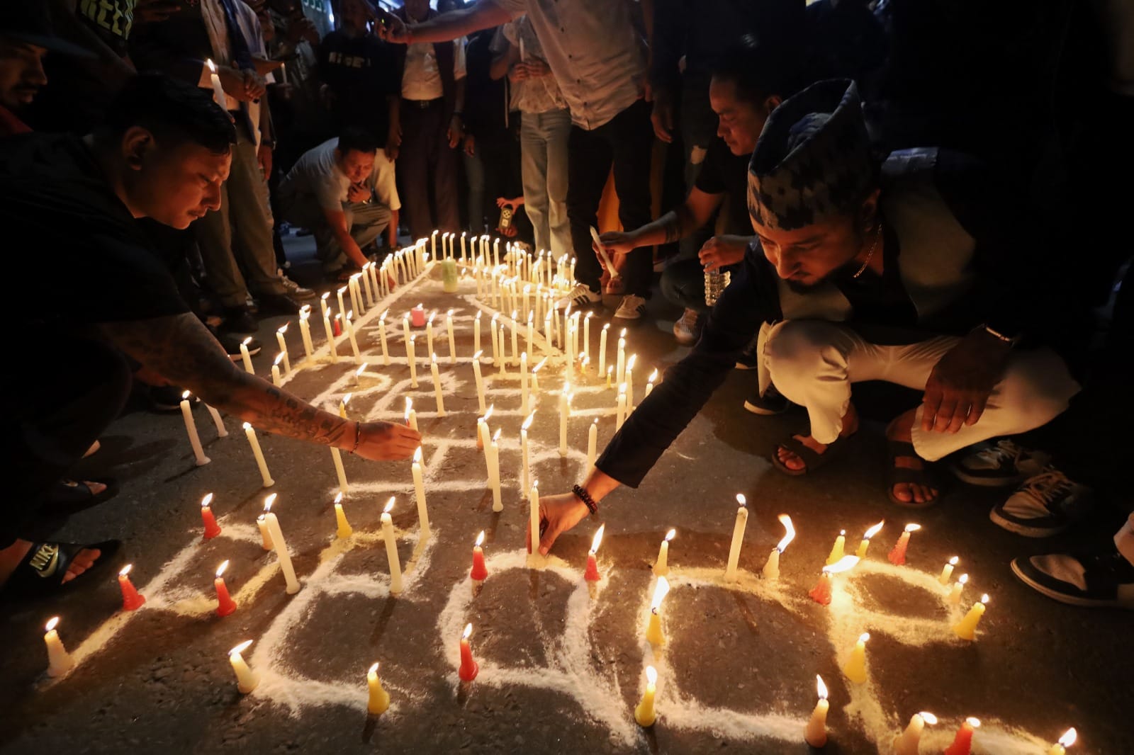 Candles burn bright at a square in Thamel as a crowd mourns the loss of precious lives | Manisha Mondal | ThePrint