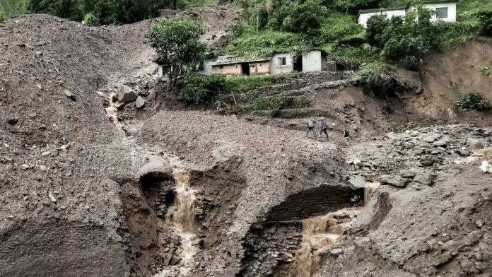 Search and rescue operation underway at a village after a landslide triggered by heavy rains, in Chamoli district, Uttarakhand. | PTI