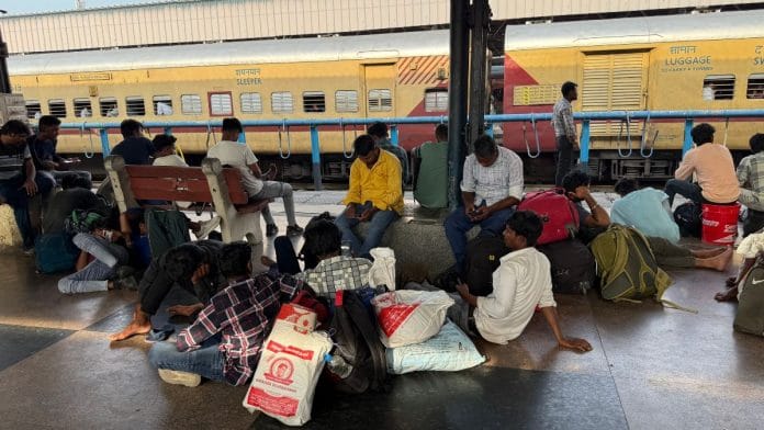 Migrant workers who left Tiruppur waiting at the MGR Chennai Central Railway Station platform for the Ganga Kaveri Express | Photo: Prabhakar Tamilarasu, ThePrint