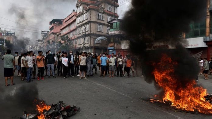 Demonstrators shout slogans as they gather to protest against Monday's killing of 19 people after anti-corruption protests that were triggered by a social media ban which was later lifted, during a curfew in Kathmandu, Nepal, September 9, 2025 | Reuters