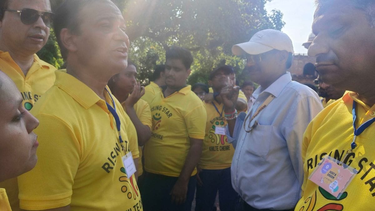 A tour guide explains the history of the Taj Mahal and Agra to the group | Almina Khatoon, ThePrint