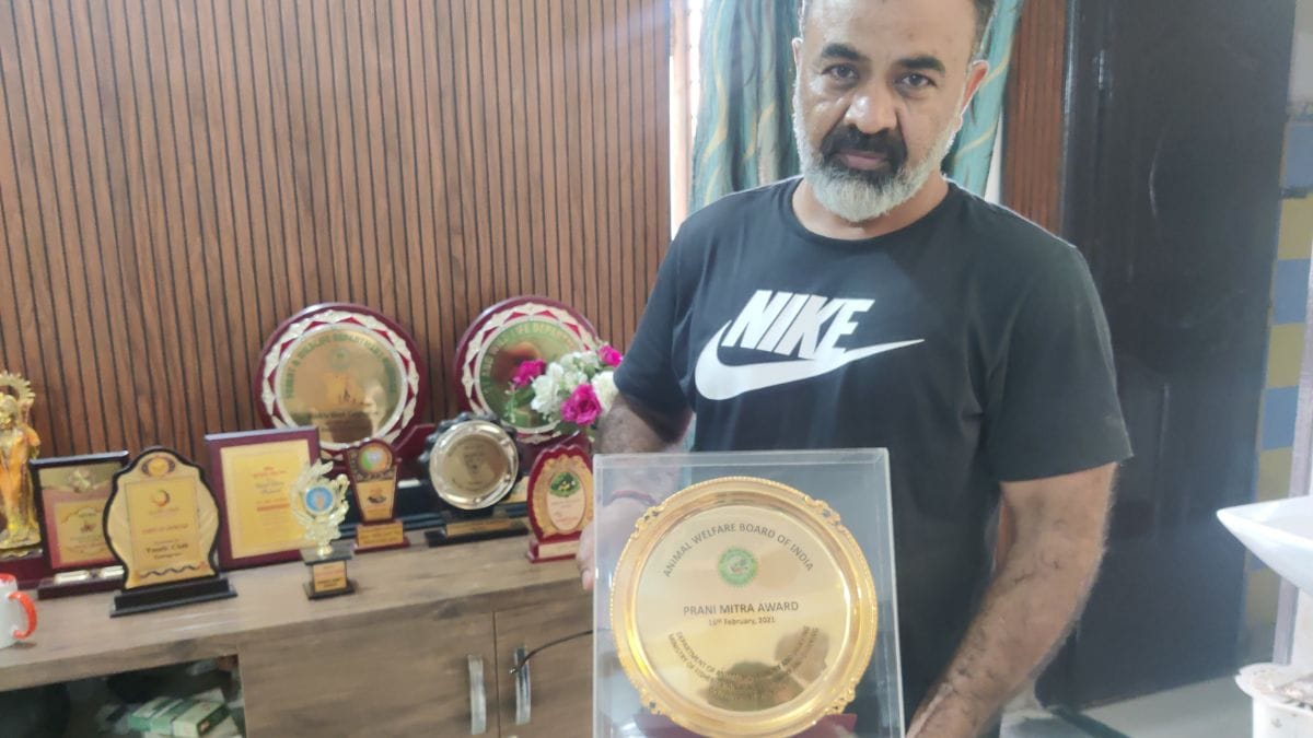 Gandas, holding the 'Prani Mitra Award' at his home in Gadoli Khurd, Gurugram | Sakshi Mehra, ThePrint