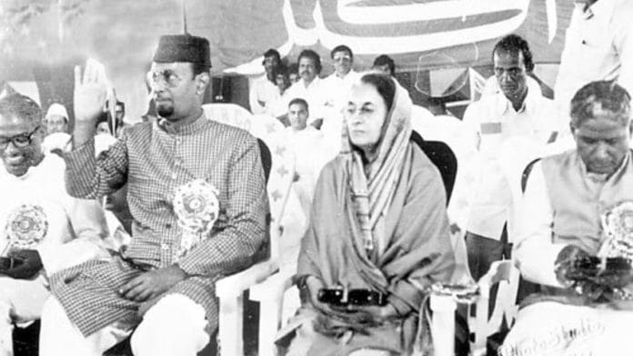 Sultan Salahuddin Owaisi in black cap sitting next to Indira Gandhi | X