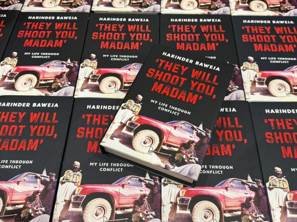 Copies of Harinder Baweja’s memoir They Will Shoot You, Madam: My Life Through Conflict