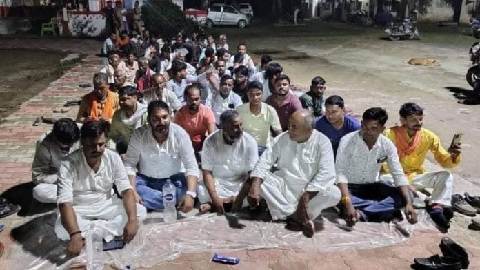 Residents of Gathiya village outside Nonhara police station on 9 September. BJP worker Siyaram Upadhyay, who died Thursday, seen on extreme right in yellow with a phone in his hand | By special arrangement