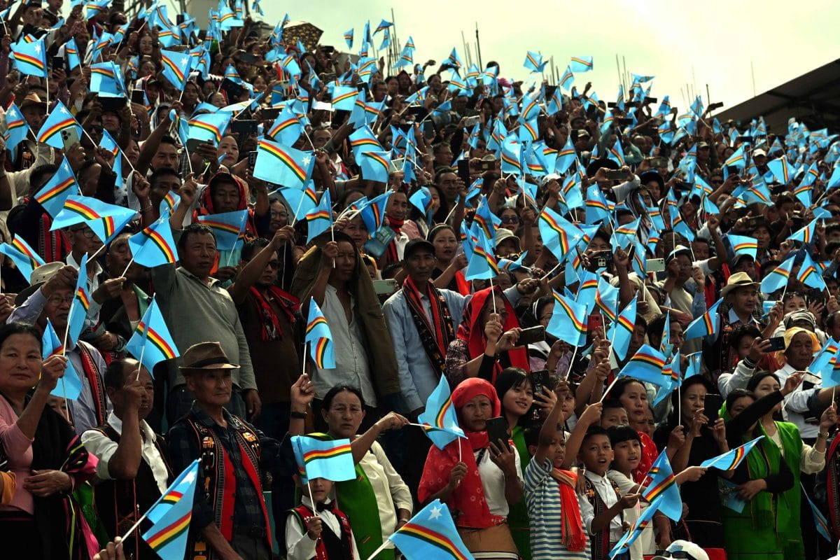 Hundreds of supporters waving NSCN (IM) flags at reception held for Muivah | ThePrint/Suraj Singh Bisht