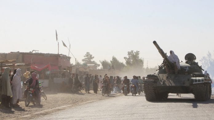 An Afghan Taliban fighter sits on a tank near the Afghanistan-Pakistan border in Spin Boldak, Kandahar Province, following exchanges of fire between Pakistani and Afghan forces a on 15 October, 2025 | Reuters